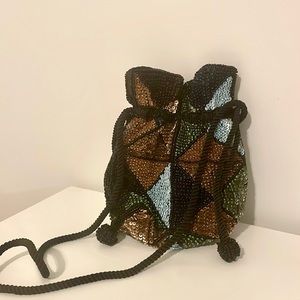 Urban Outfitters sequin drawstring satchel.